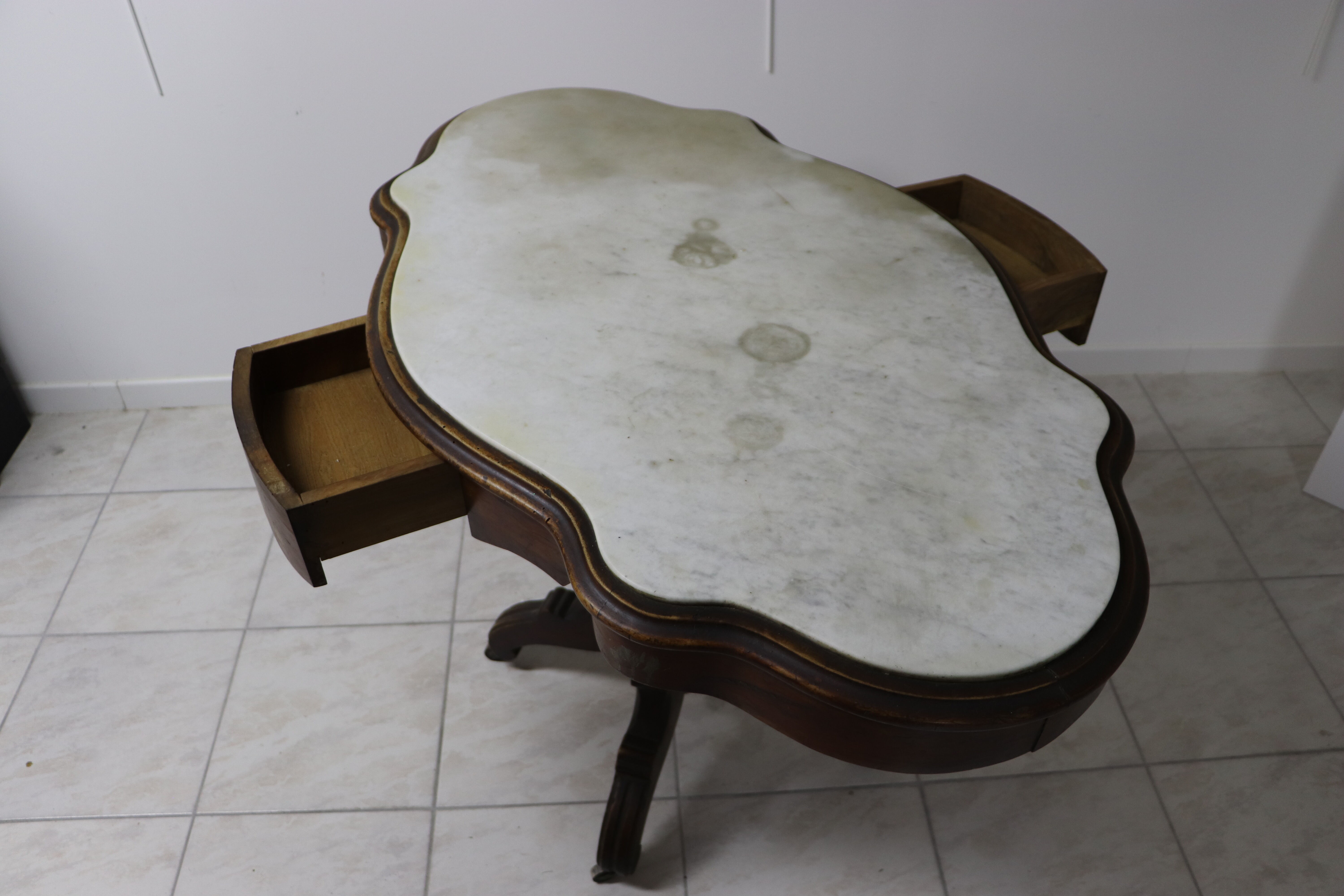 Art Deco wheeled table with 2 walnut drawers on white marble top