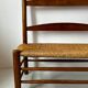 Old wooden and straw bench