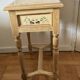 exotic wood console with a drawer