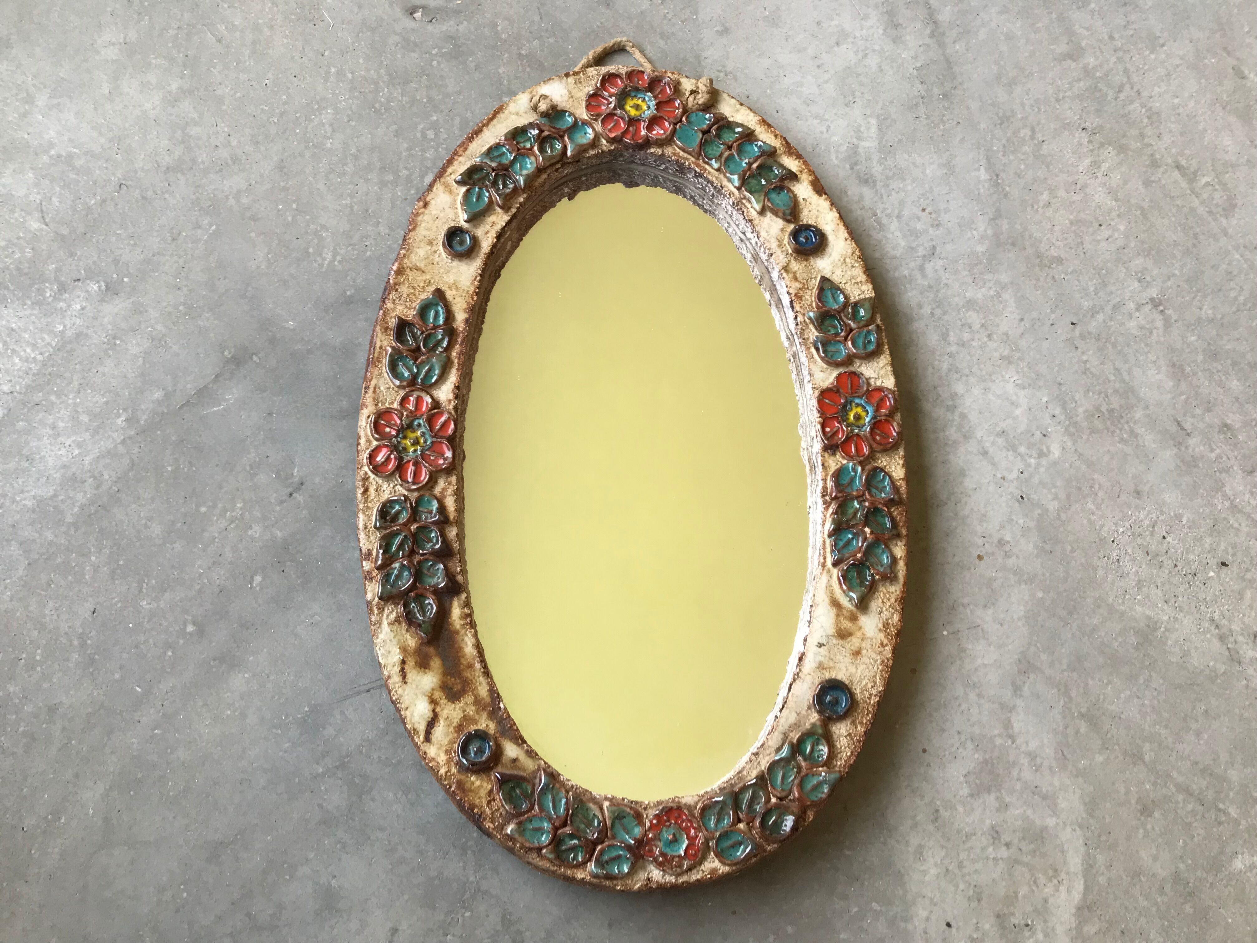 Ceramic mirror decorated with flowers, circa 1960 25x40cm