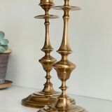 Pair of antique candle holders in solid brass