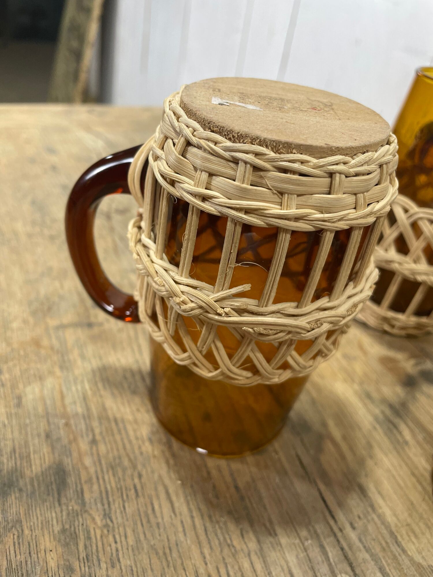 Carafe and glasses in amber glass and rattan