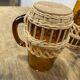 Carafe and glasses in amber glass and rattan