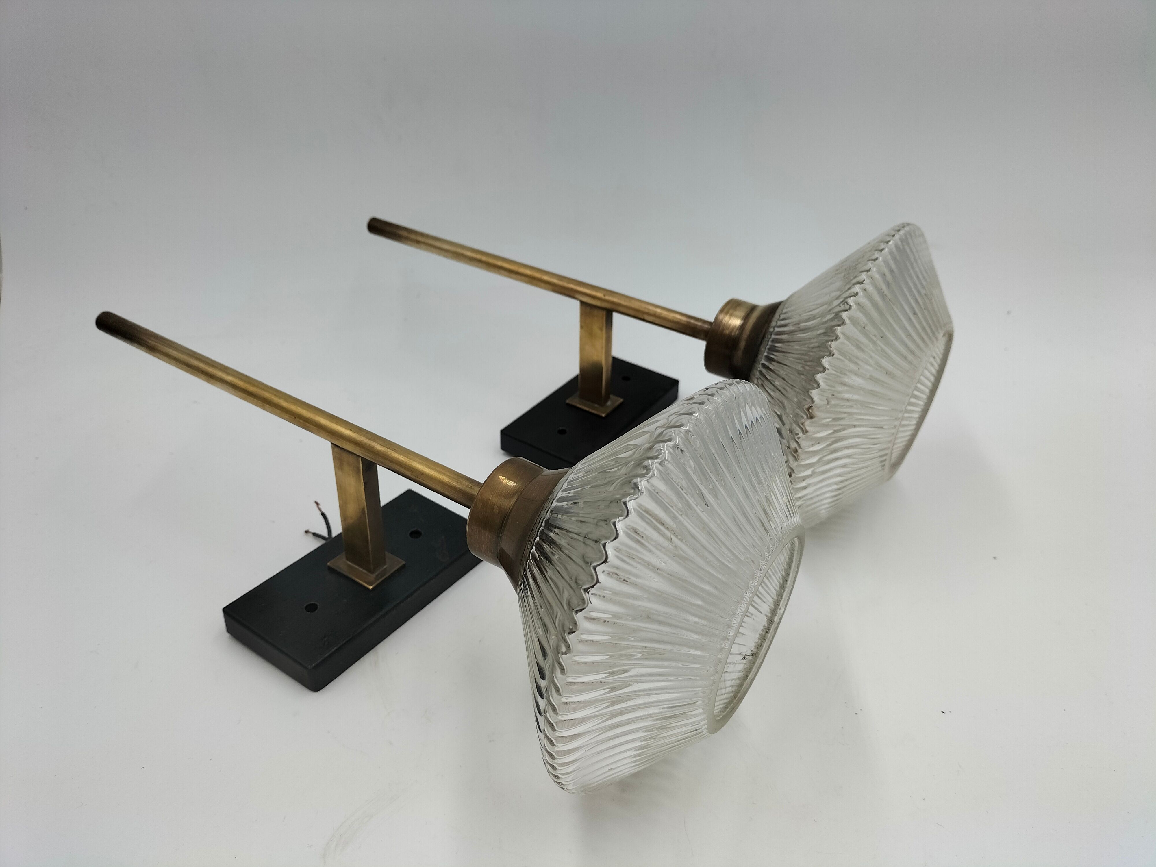 Pair of brass and glass wall lamps