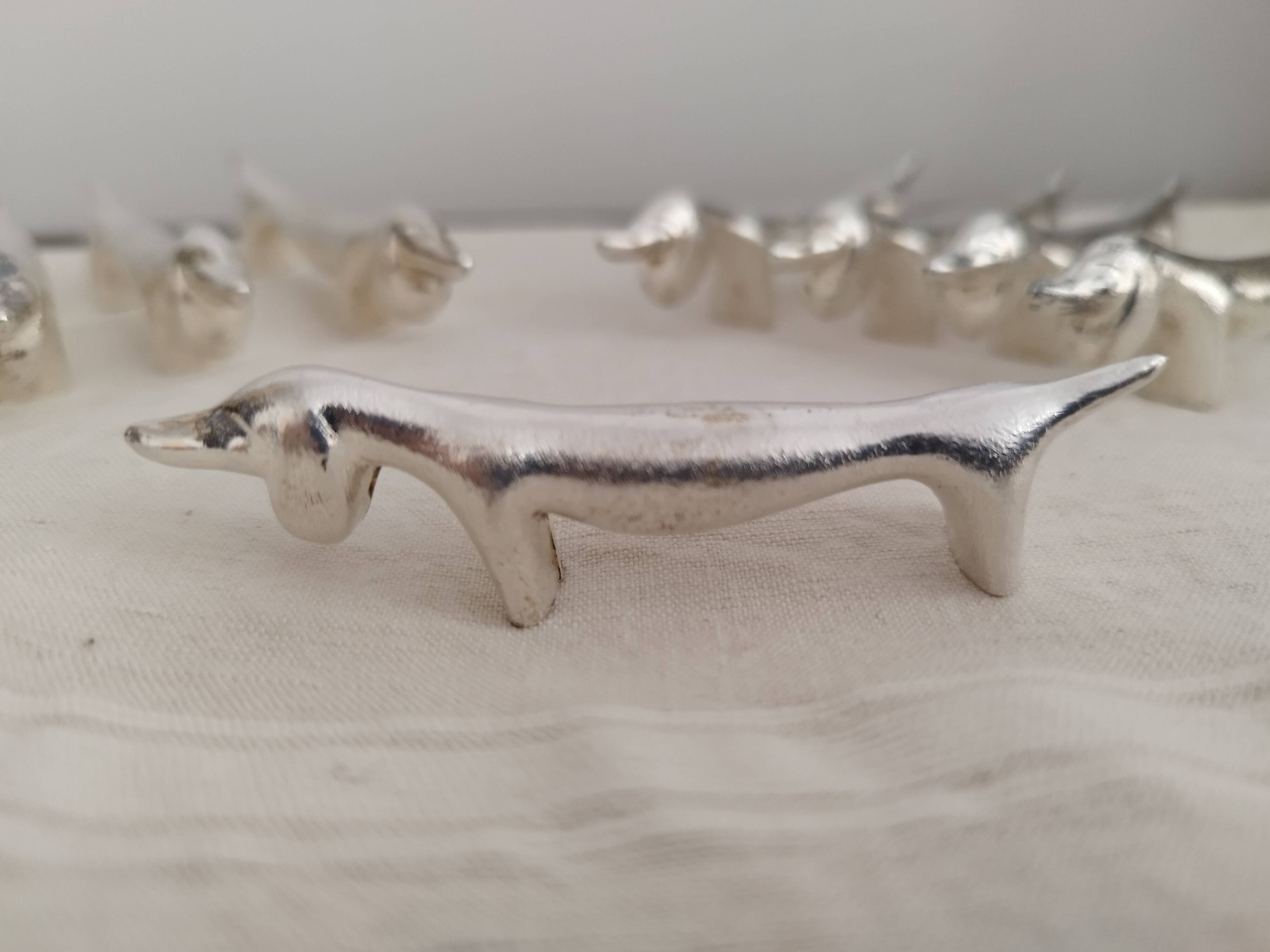 Silver metal knife holders with Dachshund dogs
