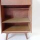 Vintage 1960s secretary desk with an angled design, light wood, and tapered legs.