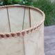 Rustic turned wood table lamp with vintage leather shade