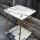 Side table in marble and brass