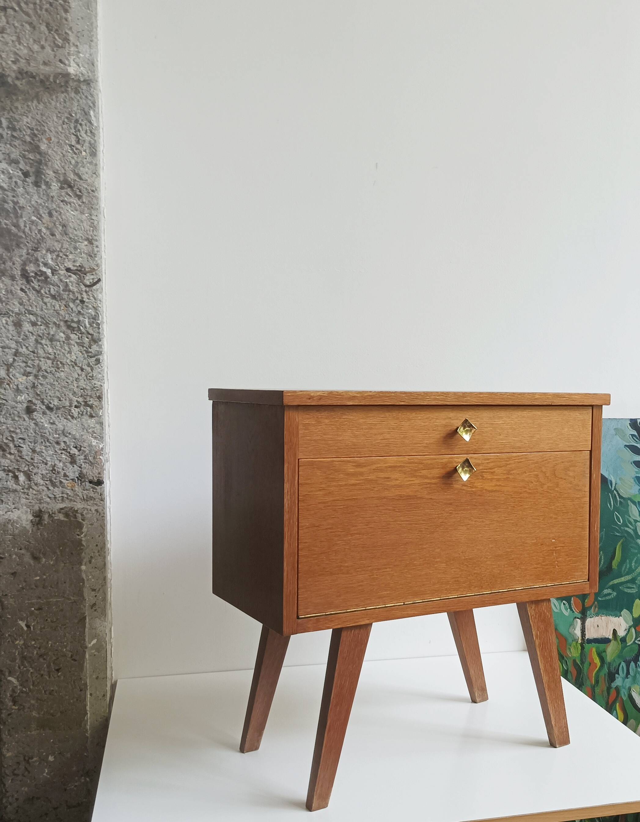 Wooden bedside table with vintage compass legs