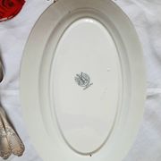 Old flat plates mismatched in iron earth accompanied by a serving dish