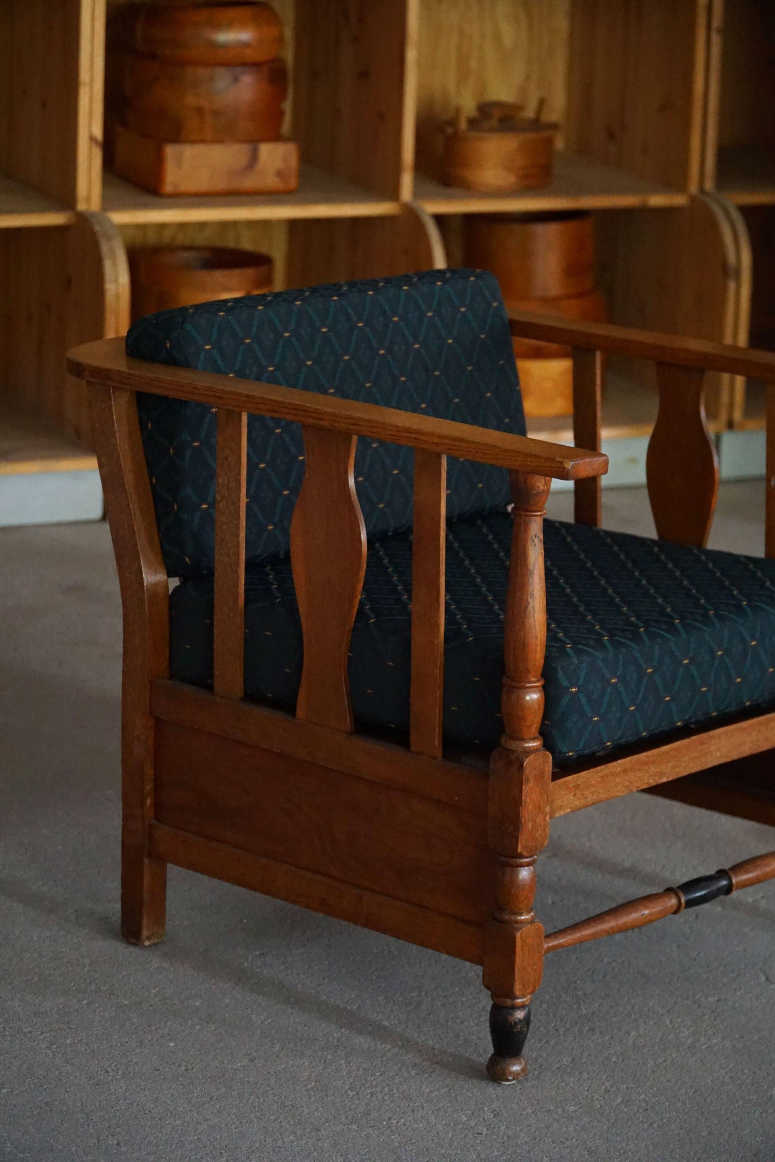 Art Nouveau, pair of oak lounge chairs, reupholstered in style fabric, 1920s.