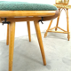 Vintage footrest stool with blue-green cushion