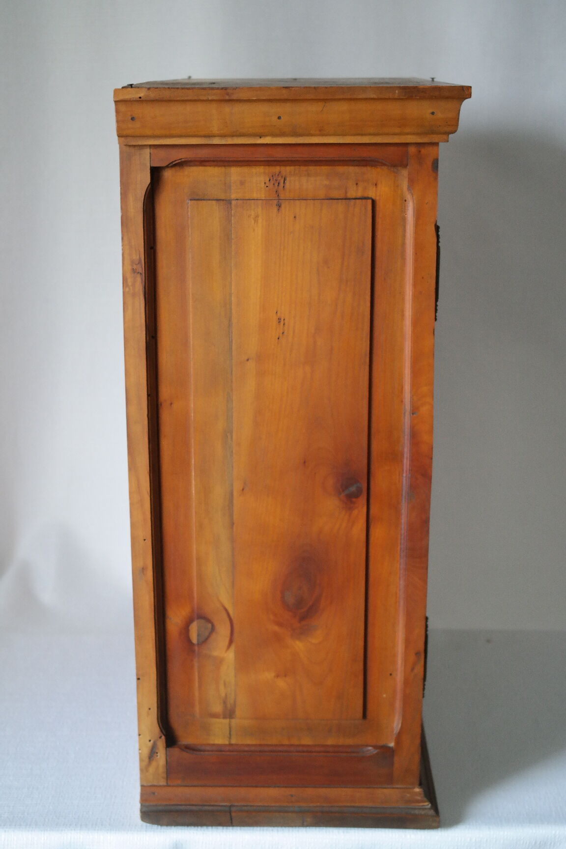Antique walnut display cabinet from the 20th century.