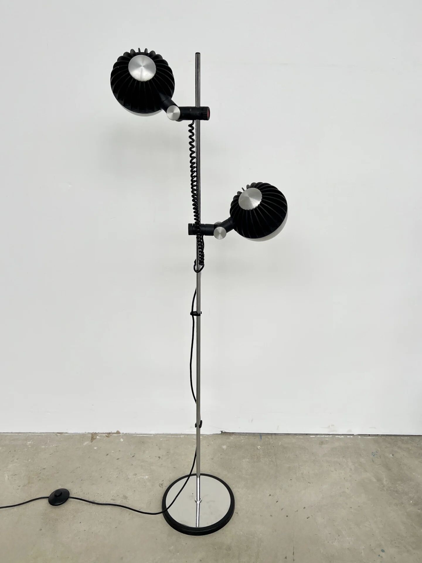 Two-spot floor lamp phase — brushed steel and matte black — 1970s