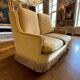 Vintage beige two-seater sofa with fringes