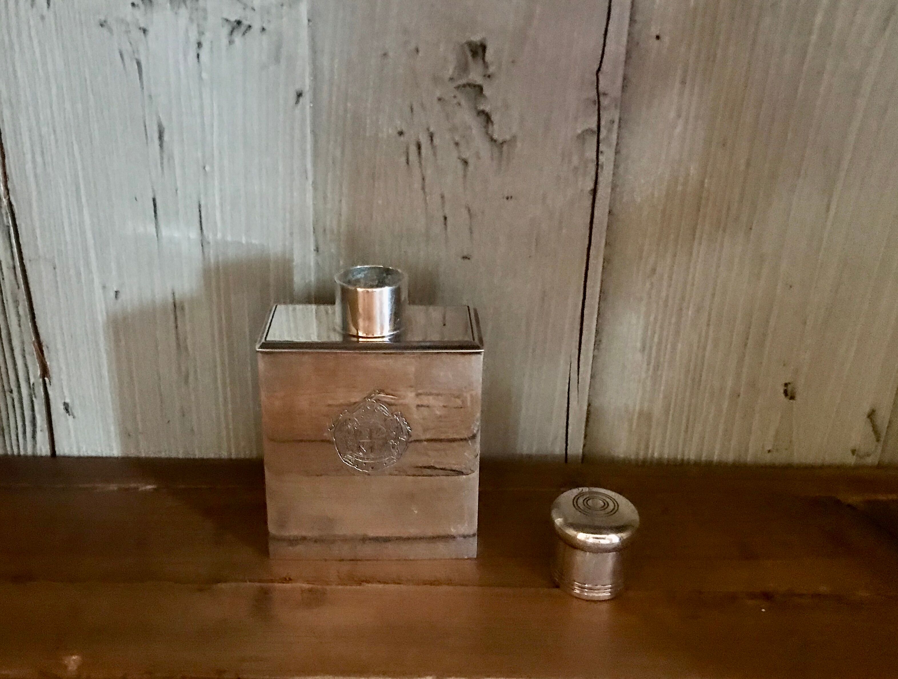 Silver metal perfume bottle