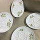 Service of six Limoges porcelain oyster plates