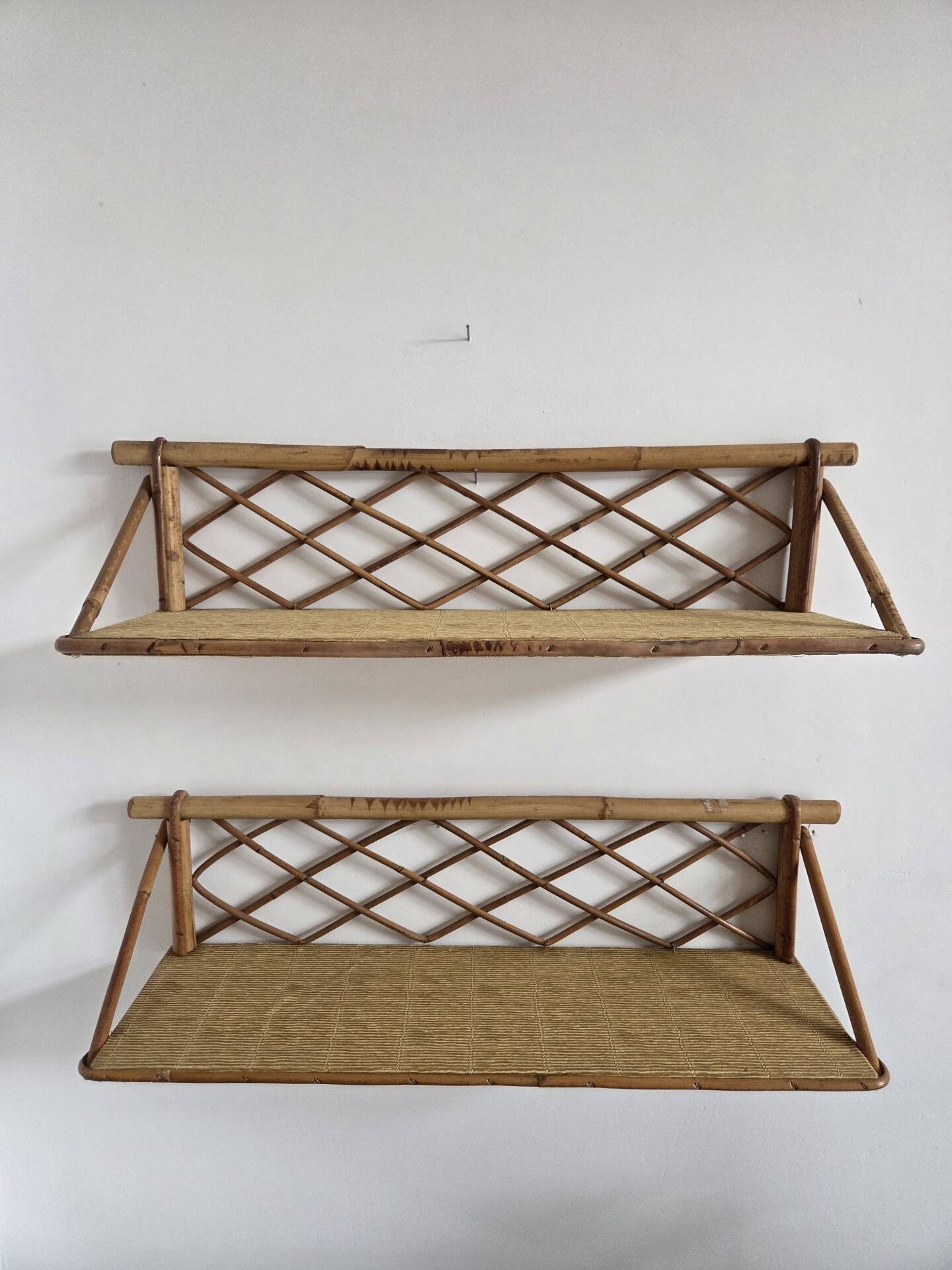 Pair of rattan shelves, 1950s/60s