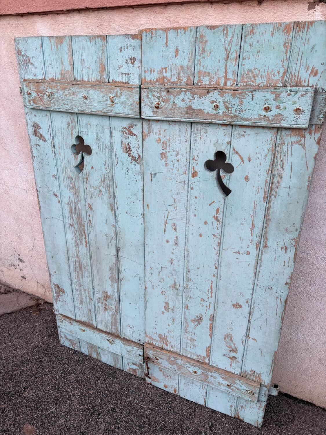 Pair of green wooden shutters