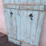 Pair of green wooden shutters