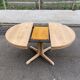 Scandinavian Baumann round extendable dining table with central leg, 115cm.