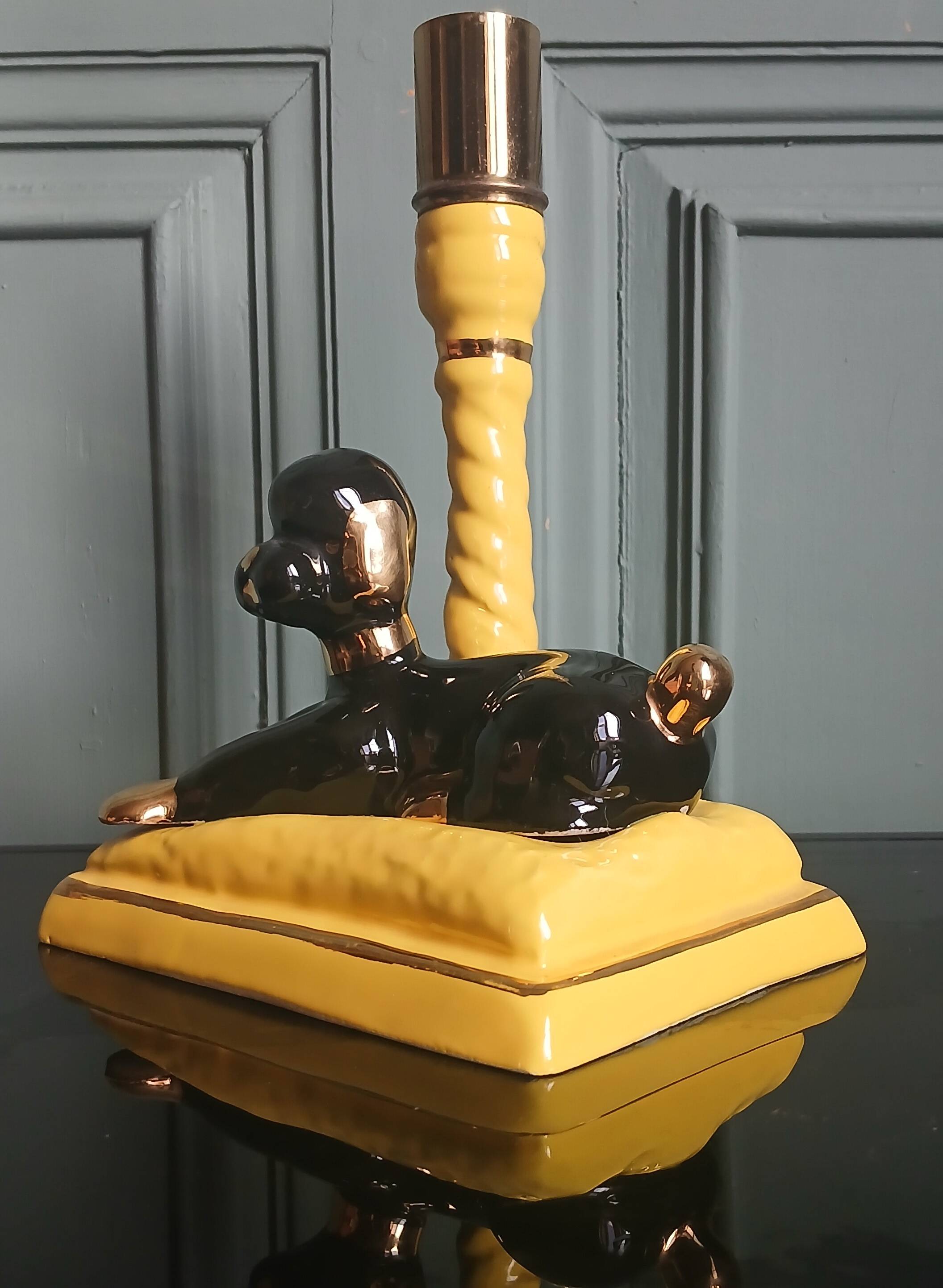 Zoomorphic lamp "poodle" in black, yellow, and gold glazed ceramic.