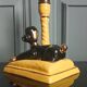 Zoomorphic lamp "poodle" in black, yellow, and gold glazed ceramic.