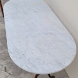 Restaurant bistro table in oval marble and decorated cast iron bases -1m51