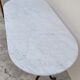 Restaurant bistro table in oval marble and decorated cast iron bases -1m51