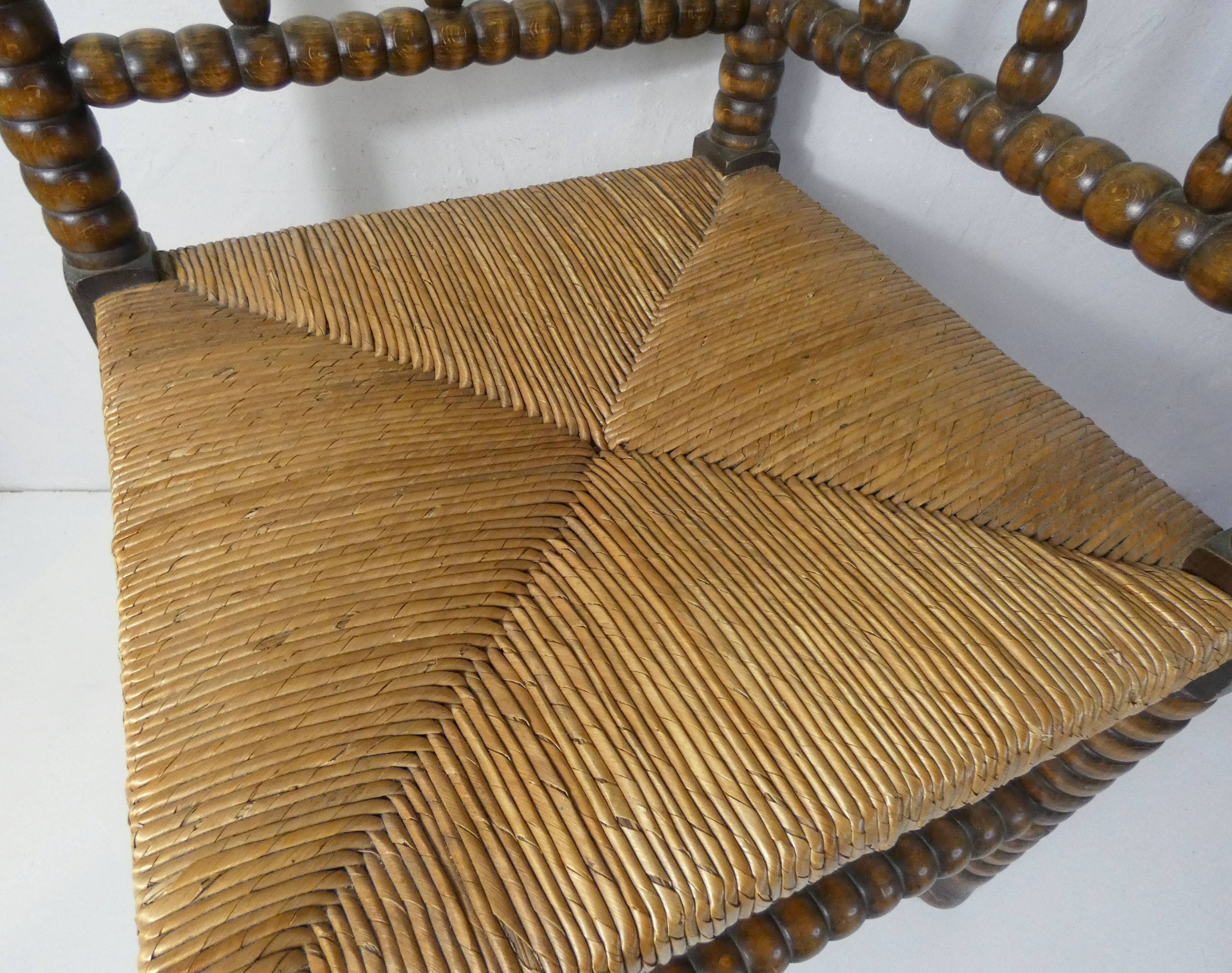 Old corner armchair beaded wood paillé