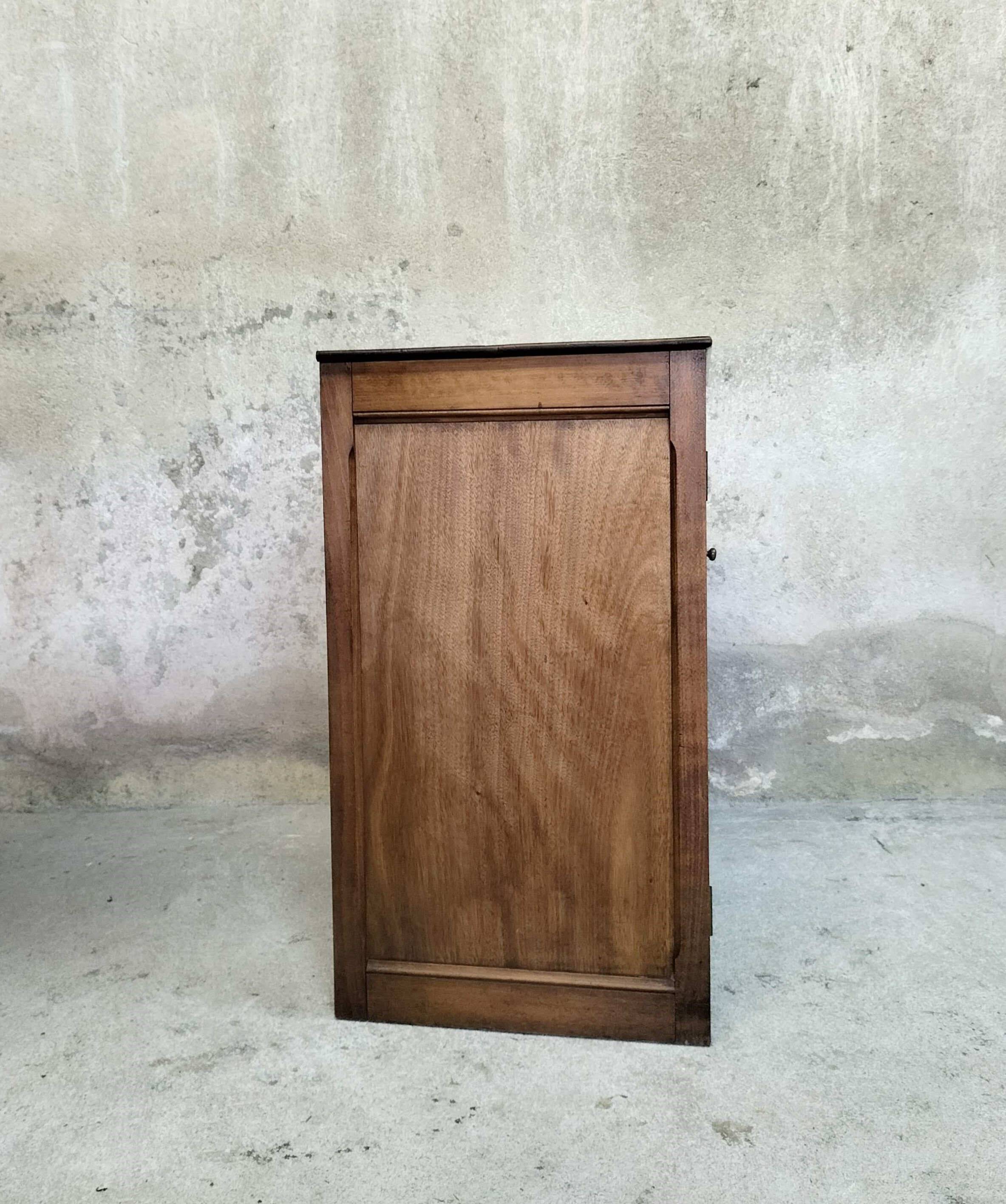 Small wooden sideboard with two doors.