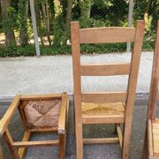 8 wooden dining chairs with straw seats, farmhouse style, high back.