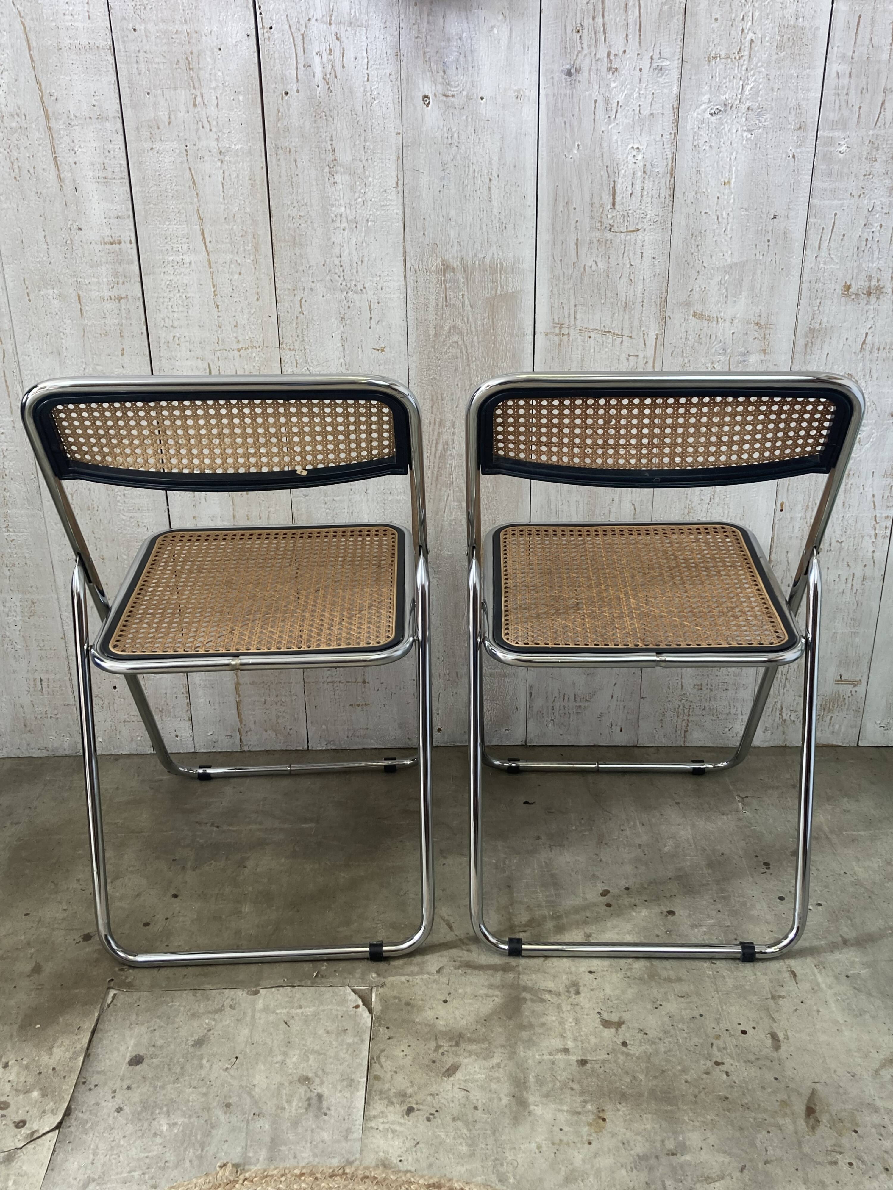 Pair of chrome and cane folding chairs