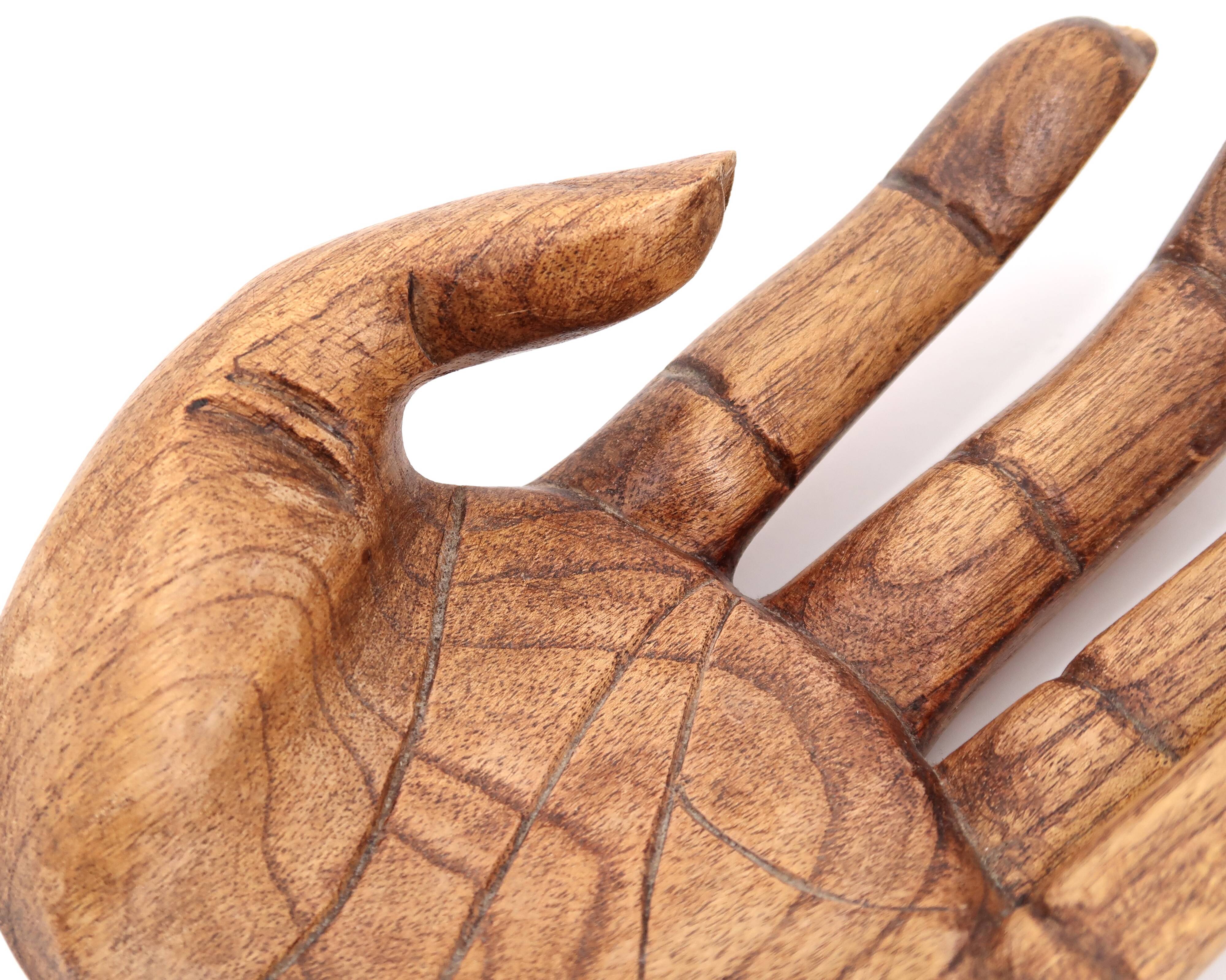 Empty wooden pocket in the shape of a hand, vintage