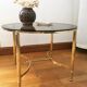 Brass round coffee table and smoked glass