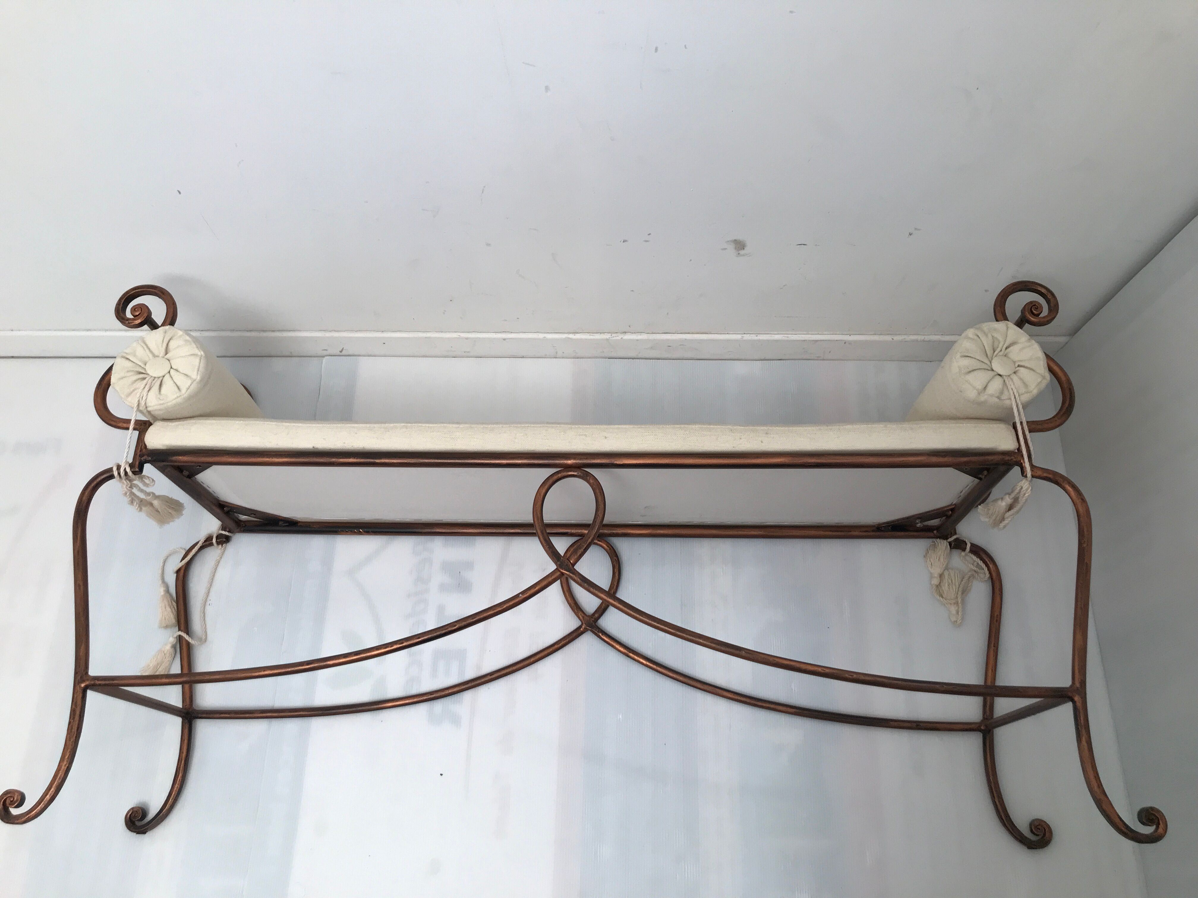 Copper wrought iron bench with cushions