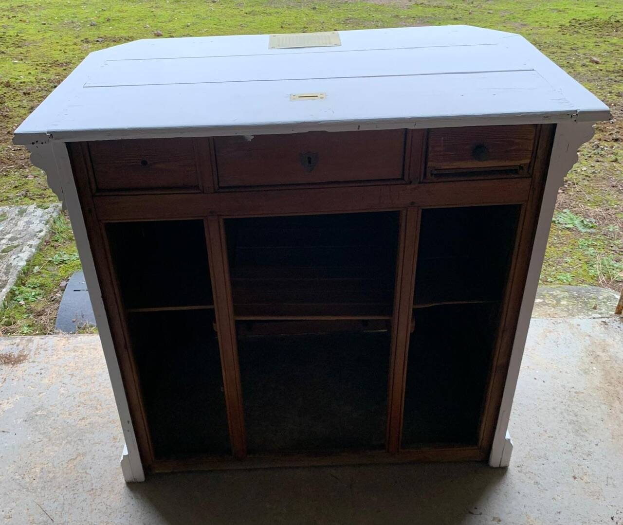 White counter with brass coin mechanism