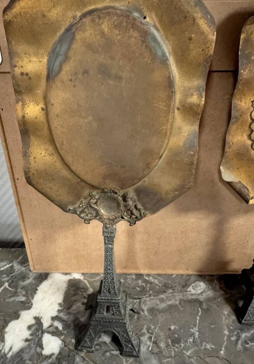 Pair of brass mirrors from the Art Deco period perched on the Eiffel Tower.
