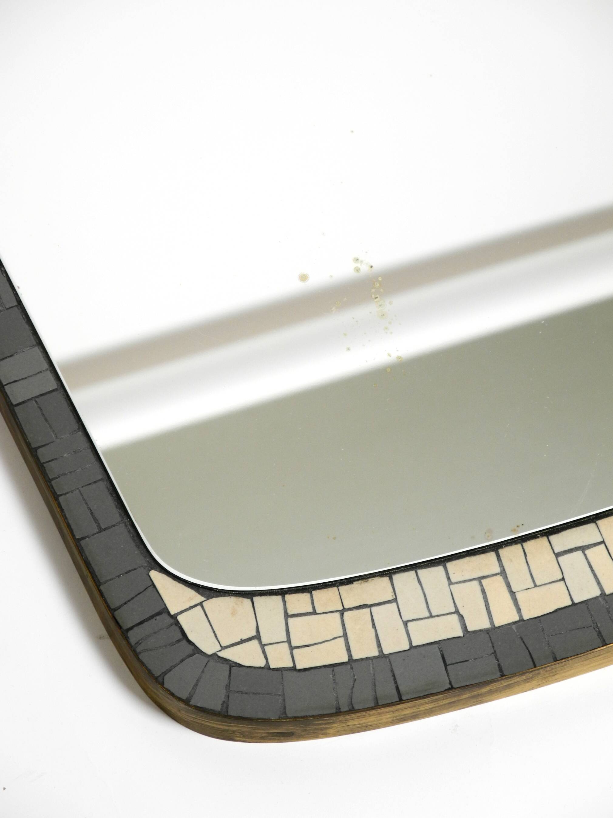 Mid Century mosaic wall mirror with brass frame by Münchner Zierspiegel