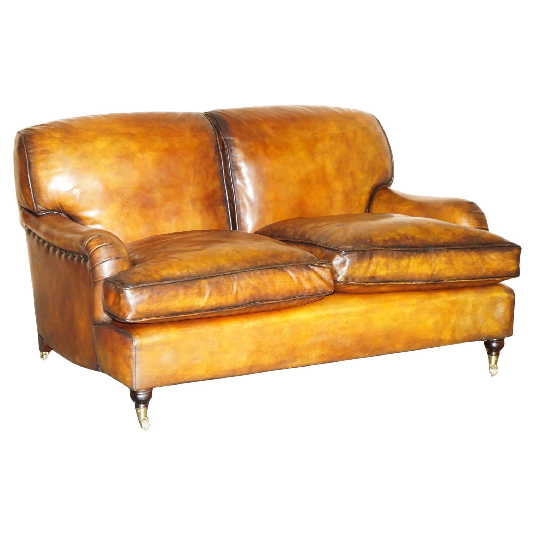 Howard & Son restored leather canapé, width 145 cm