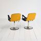 Pair of European 1970s swivel armchairs in faux leather and steel
