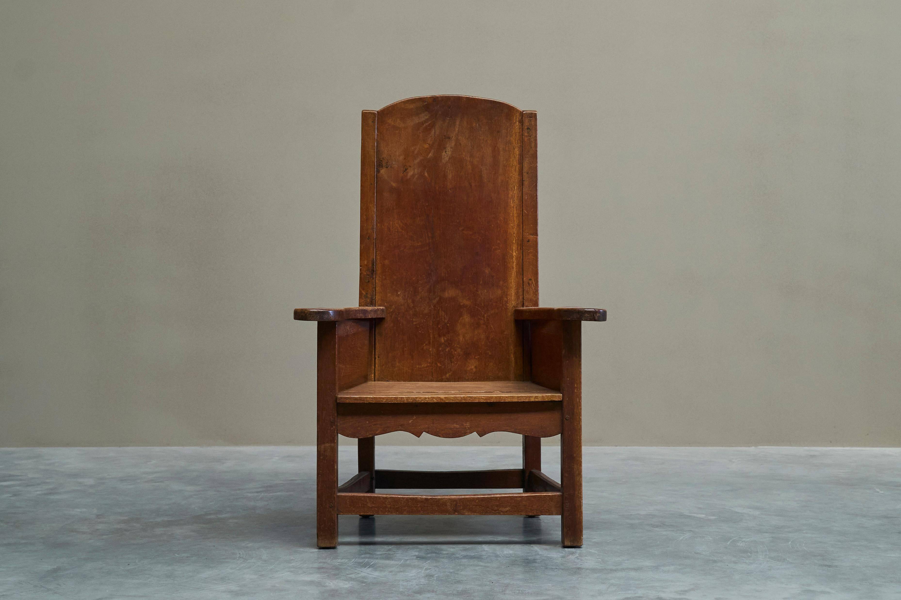 Antique solid oak armchair, 19th-century farmer style.