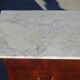 Antique mahogany chest of drawers with white marble.
