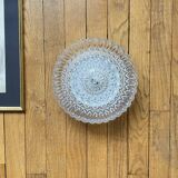 Large wall-mounted ceiling light with transparent glass.