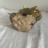 Old slipware birds on a tree trunk