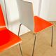 2 bicoloured wooden and steel chairs in orange and red from Habitat, around 1990.