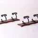 wood and wrought iron coat racks, set of two