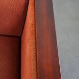 Art Deco design armchair with red fabric upholstery and wooden details