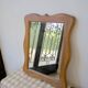 Wooden mirror with a shaped frame