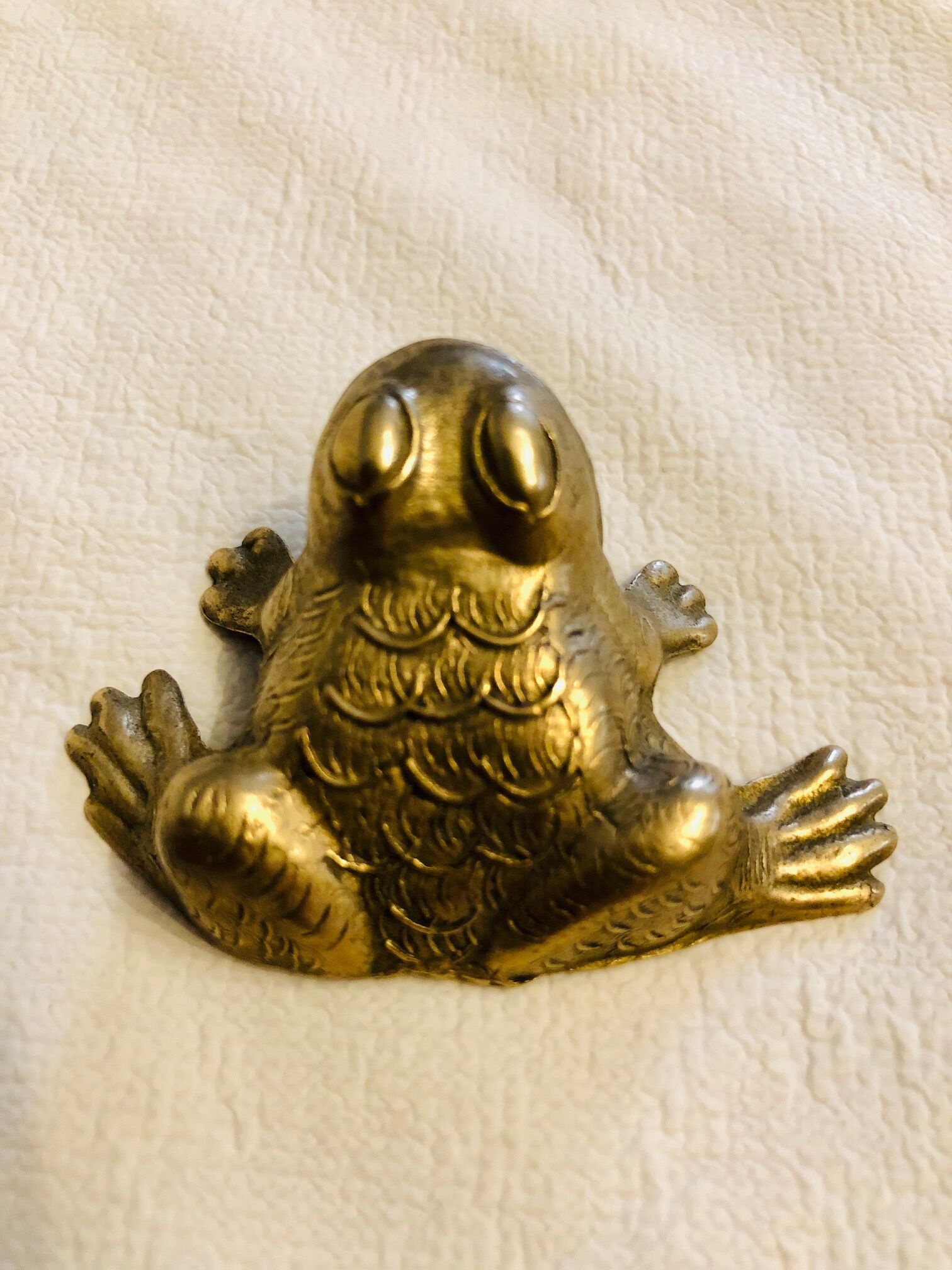 Small brass frog